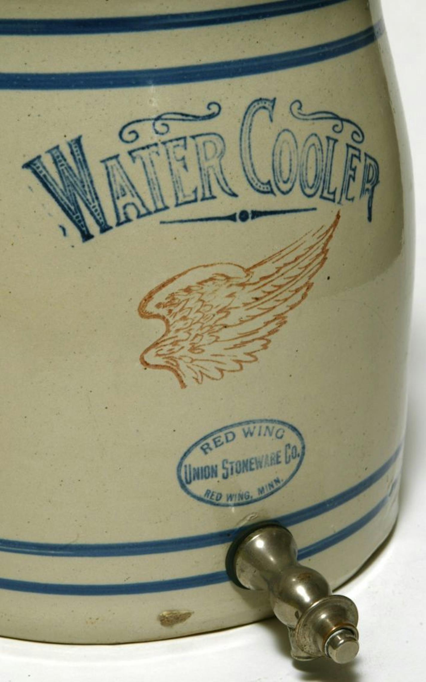 Jim Stiller of Excelsior Coin is a dealer in Red Wing Pottery. the national convention is being held in Red Wing starting July 10. Pictured is 3 gallon hand turned water cooler zinc glazed made around 1910-1915.