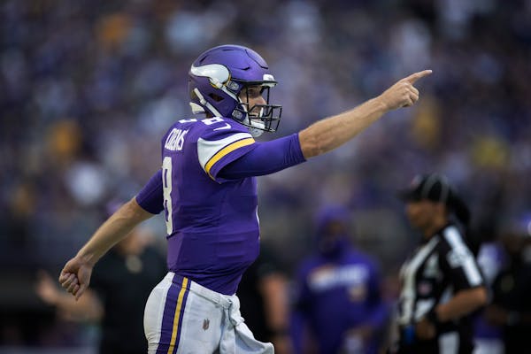 Kirk Cousins reacted after throwing a touchdown pass in the second quarter.