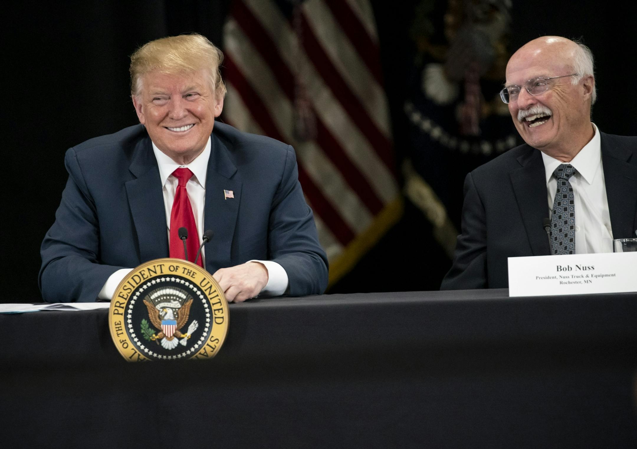 President Donald J. Trump spoke at Nuss Truck and Equipment in Burnsville during a roundtable discussion on tax cuts and the U.S. economy in Burnsville, Minn., on Monday, April 15, 2019. At right is the president of Nuss Truck and Equipment Bob Nuss.