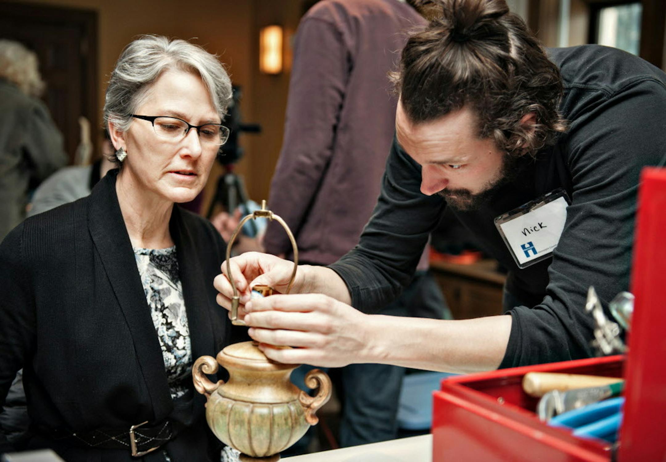 A volunteer works on fixing a patron's broken lamp at the Fix It Clinic at the Bakken Museum in Minneapolis on January 11, 2014. ] Photo by Leslie Plesser / Star Tribune