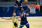 Minnesota Timberwolves forward Anthony Edwards (1) missed the layup but was fouled by Golden State Warriors guard Stephen Curry (30) for a chance at t