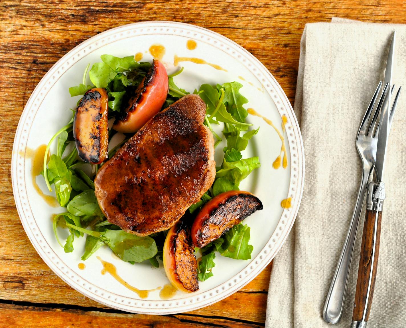 Five-Spice Pan-Seared Pork Chops and Caramelized Apples is an impressive meal any day of the week. Recipe and photo from Meredith Deeds, Special to the Star Tribune.