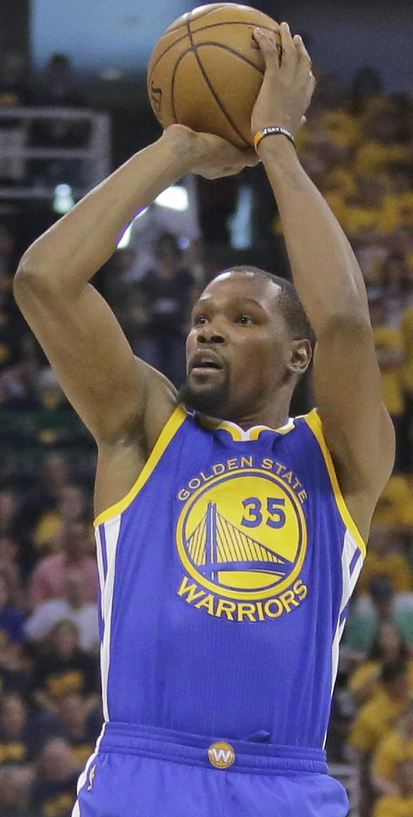 Golden State Warriors forward Kevin Durant (35) shoots as Utah Jazz forward Joe Ingles, left, defends in the first half during Game 3 of the NBA basketball second-round playoff series Saturday, May 6, 2017, in Salt Lake City. (AP Photo/Rick Bowmer)