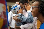 Rep. Ilhan Omar hugged her husband Ahmed Hirsi after she won the DFL endorsement. Their daughter Isra Hirsi, 15, is on the right. ] GLEN STUBBE &#xef;