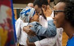 Rep. Ilhan Omar hugged her husband Ahmed Hirsi after she won the DFL endorsement. Their daughter Isra Hirsi, 15, is on the right. ] GLEN STUBBE &#xef;