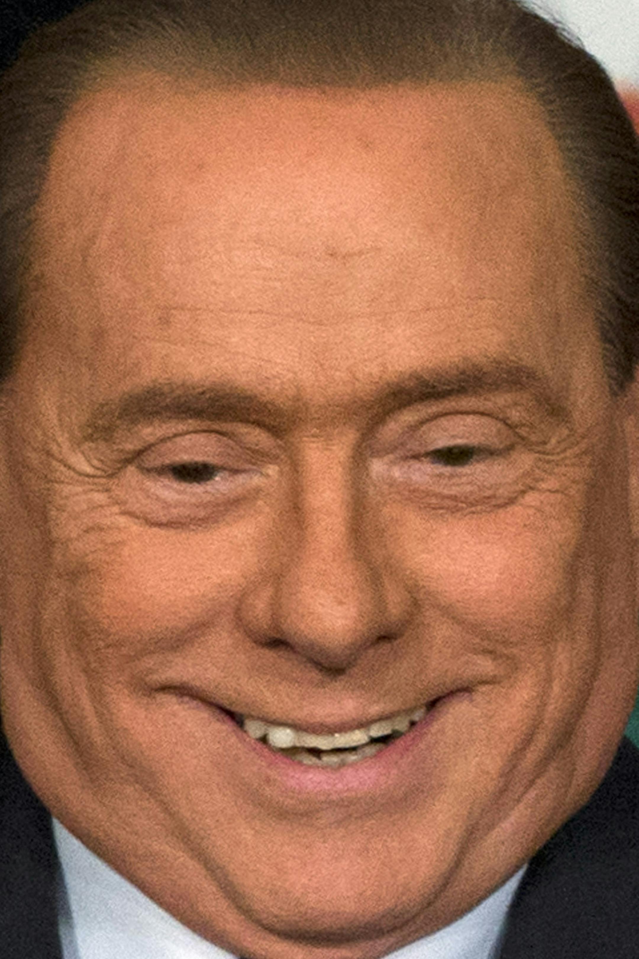 Italian former Premier and Forza Italia, Go Italy, party leader Silvio Berlusconi arrives at a press conference to present his party's candidates for the upcoming European Parliament elections, in Rome, Thursday, April 17, 2014. Berlusconi was ordered Tuesday to spend four hours a week helping the elderly to repay society for his tax fraud conviction, a sentence that imposes few restrictions on his campaigning in the upcoming European elections. The 77-year-old three-time former premier cannot r