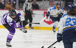 The Frost's Dominique Petrie takes a shot on goal as Toronto's Maggie Connors defends on Feb. 23 at Xcel Energy Center, where the Sceptres beat the de