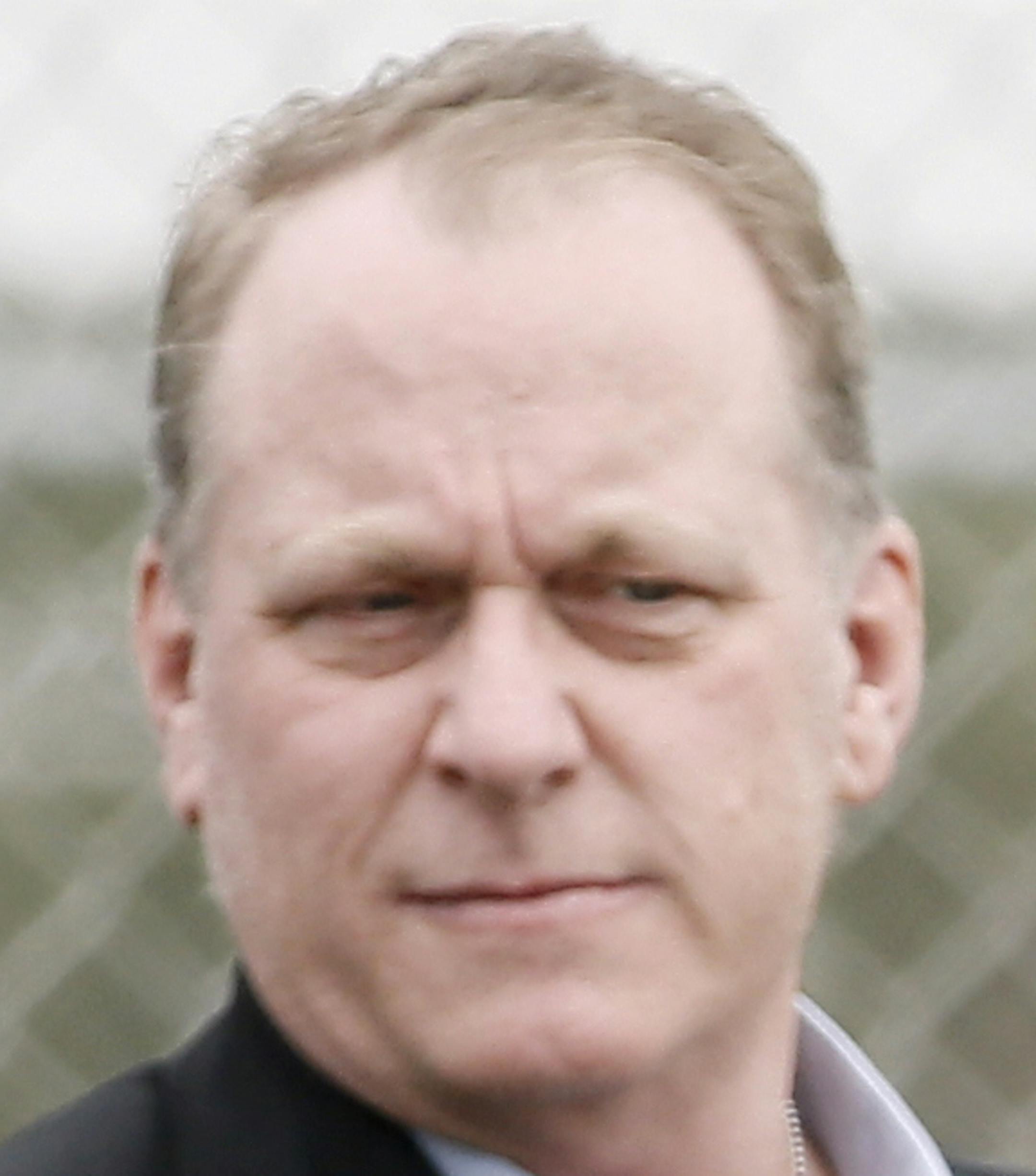 Baseball analyst and former Boston Red Sox pitcher Curt Schilling, left, watches as Dustin Pedroia, right, and other infielders take batting practice at baseball spring training in Fort Myers Fla., Wednesday Feb. 25, 2015. (AP Photo/Tony Gutierrez) ORG XMIT: FLTG108