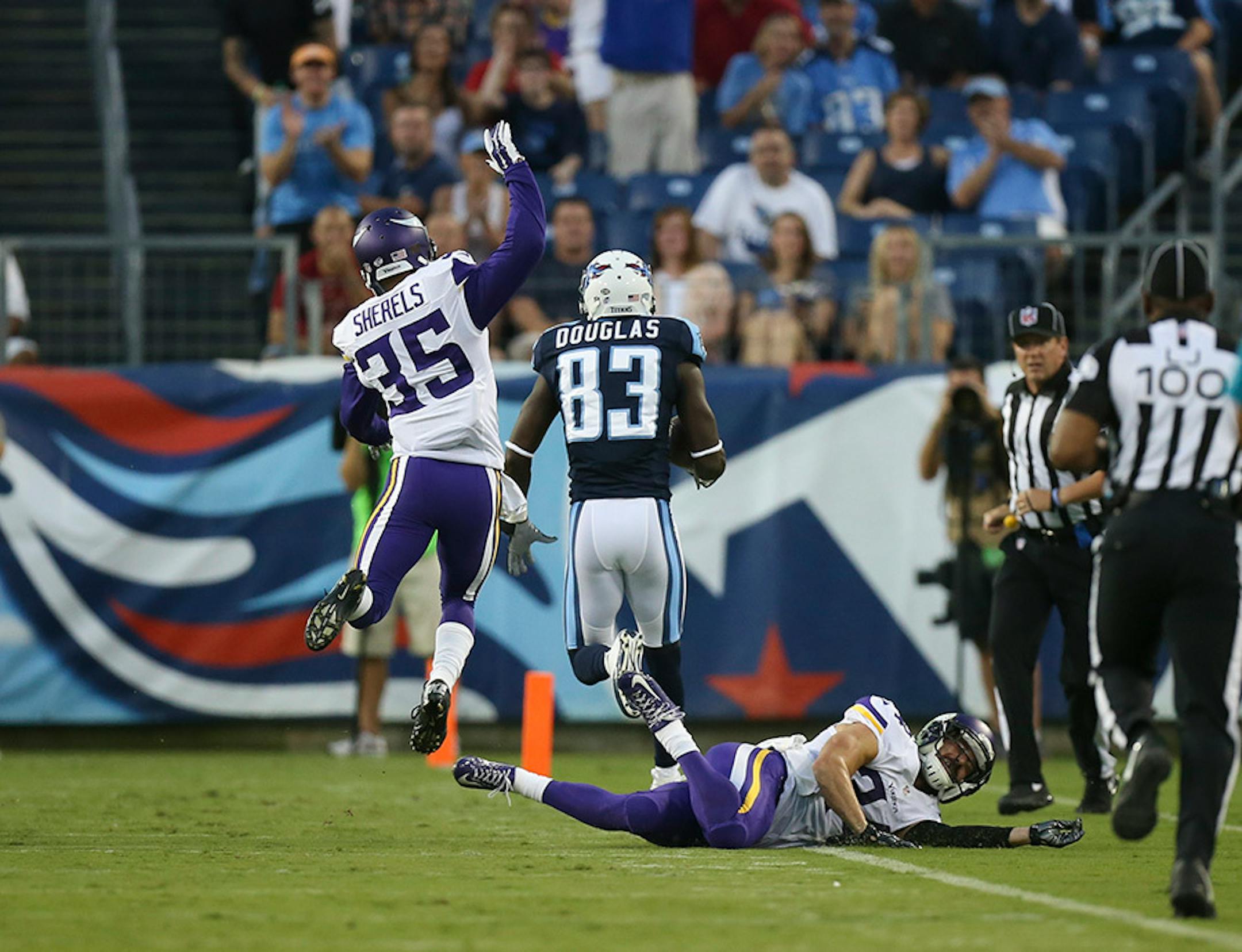 Tennessee Titans wide receiver Harry Douglas (83) left Vikings cornerback Marcus Sherels (35) and strong safety Andrew Sendejo (34) in his wake as he caught a short pass for a 59 yard touchdown in the first quarter Thursday night.