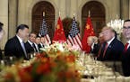 FILE - In this Dec. 1, 2018, file photo, U.S. President Donald Trump, second right, and China's President Xi Jinping, second left, attend their bilate