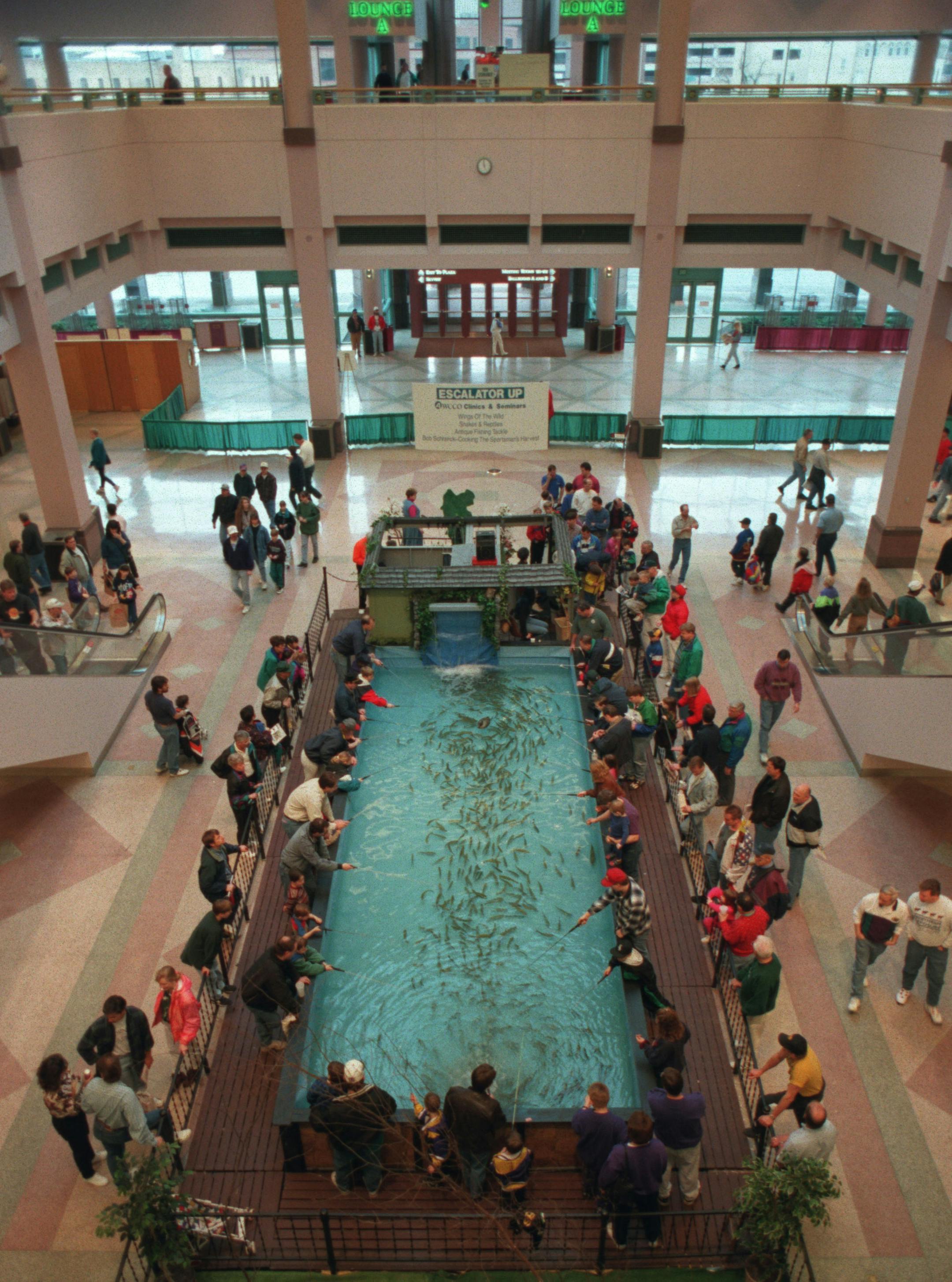 The Trout Fishin' Pond owned by Dick Hansen of St. Croix Falls, Wis. attracted many children and adults trying their fishing skills at the 63rd Annual Northwest Sportshow at the Minneapolis Convention Center Saturday. The show will continue through April 2, 1995. ORG XMIT: MIN2014032016314573