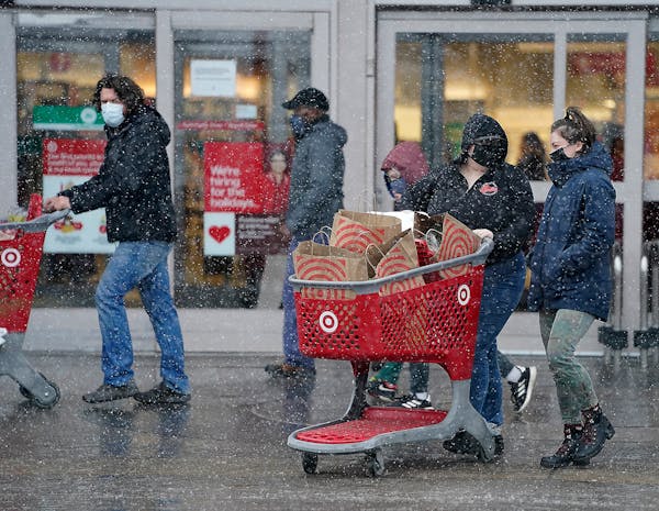 Shoppers try to beat the snowstorm before the holidays Wednesday, Dec. 23, 2020 at a Target Super Store in Richfield, Minnesota. (David Joles/Minneapo