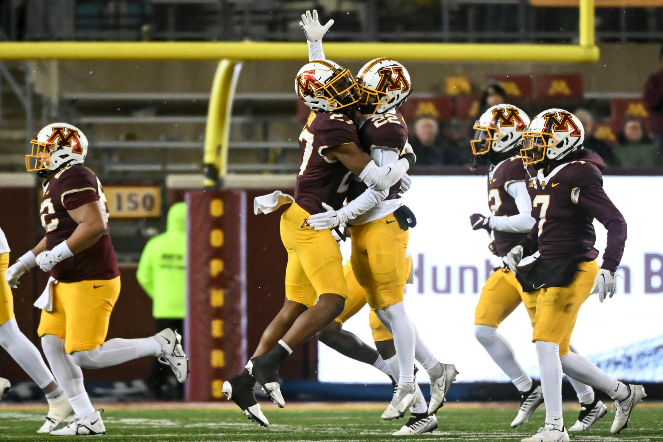 Minnesota Gophers defensive back Tyler Nubin (27) and defensive back Ryan Stapp (22) celebrate an interception by Stapp during the second half.