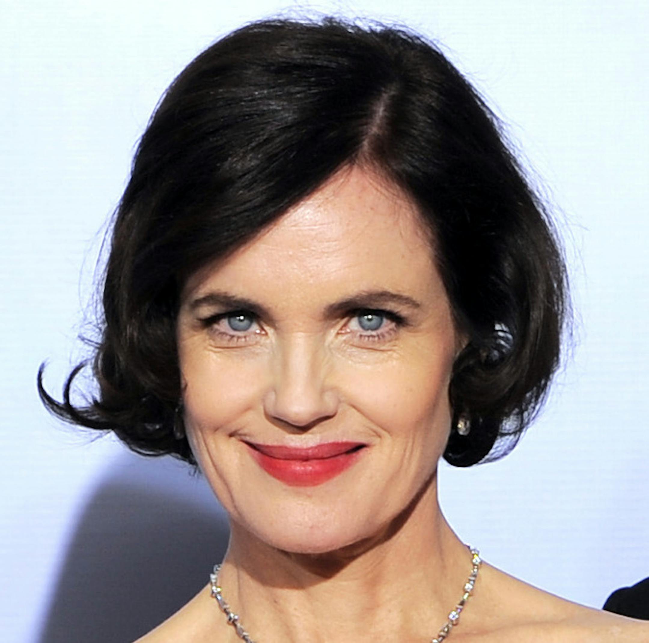 Julian Fellows, left, Elizabeth McGovern and Hugh Bonneville pose backstage with the award for Best Mini-Series or Motion Picture Made for Television for "Downtown Abbey" during the 69th Annual Golden Globe Awards Sunday, Jan. 15, 2012, in Los Angeles. (AP Photo/Mark J. Terrill)