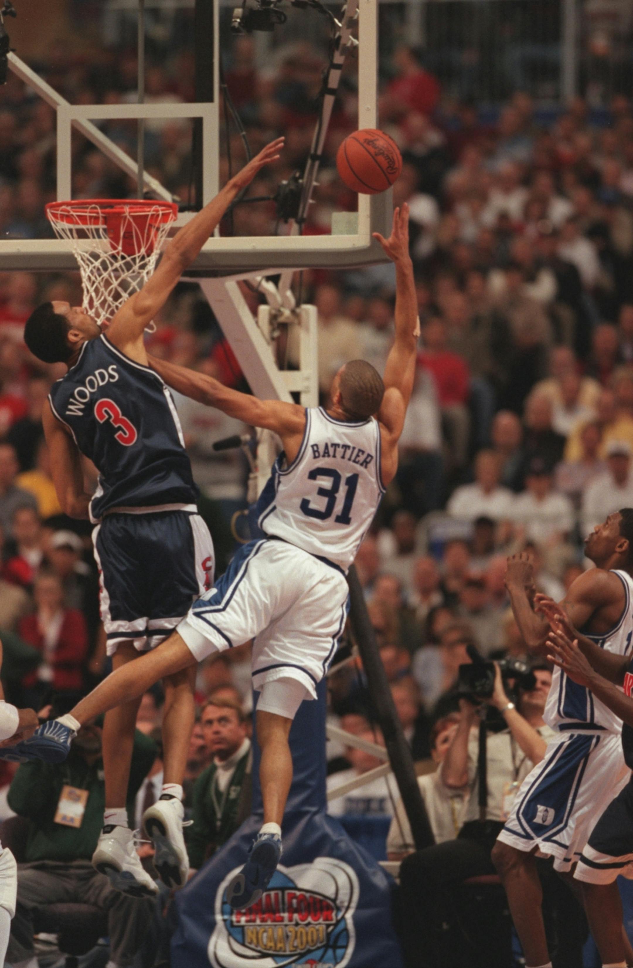 Duke's Shane Battier takes a shot against Arizona's Loren Woods during the championship game of the Final Four in 2001. (Carlos Gonzalez/Star Tribune)