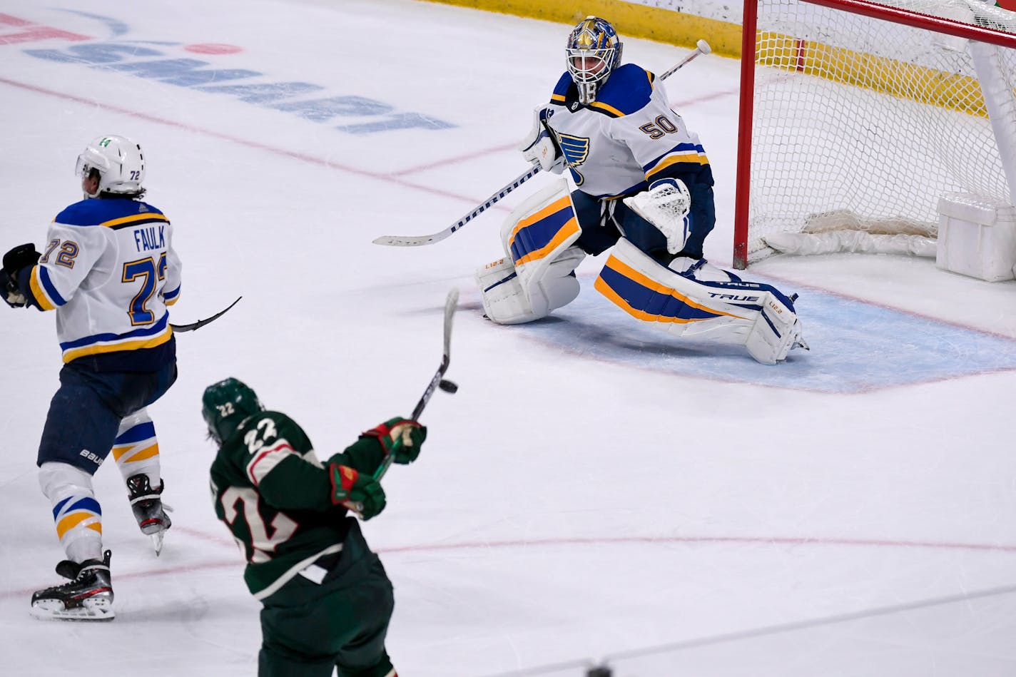 Minnesota Wild left wing Kevin Fiala&nbsp;(22) hits a slapshot into the goal past St. Louis Blues goalie Jordan Binnington (50) to win in overtime during an NHL hockey game Saturday, May 1, 2021, in St. Paul, Minn. (AP Photo/Craig Lassig)