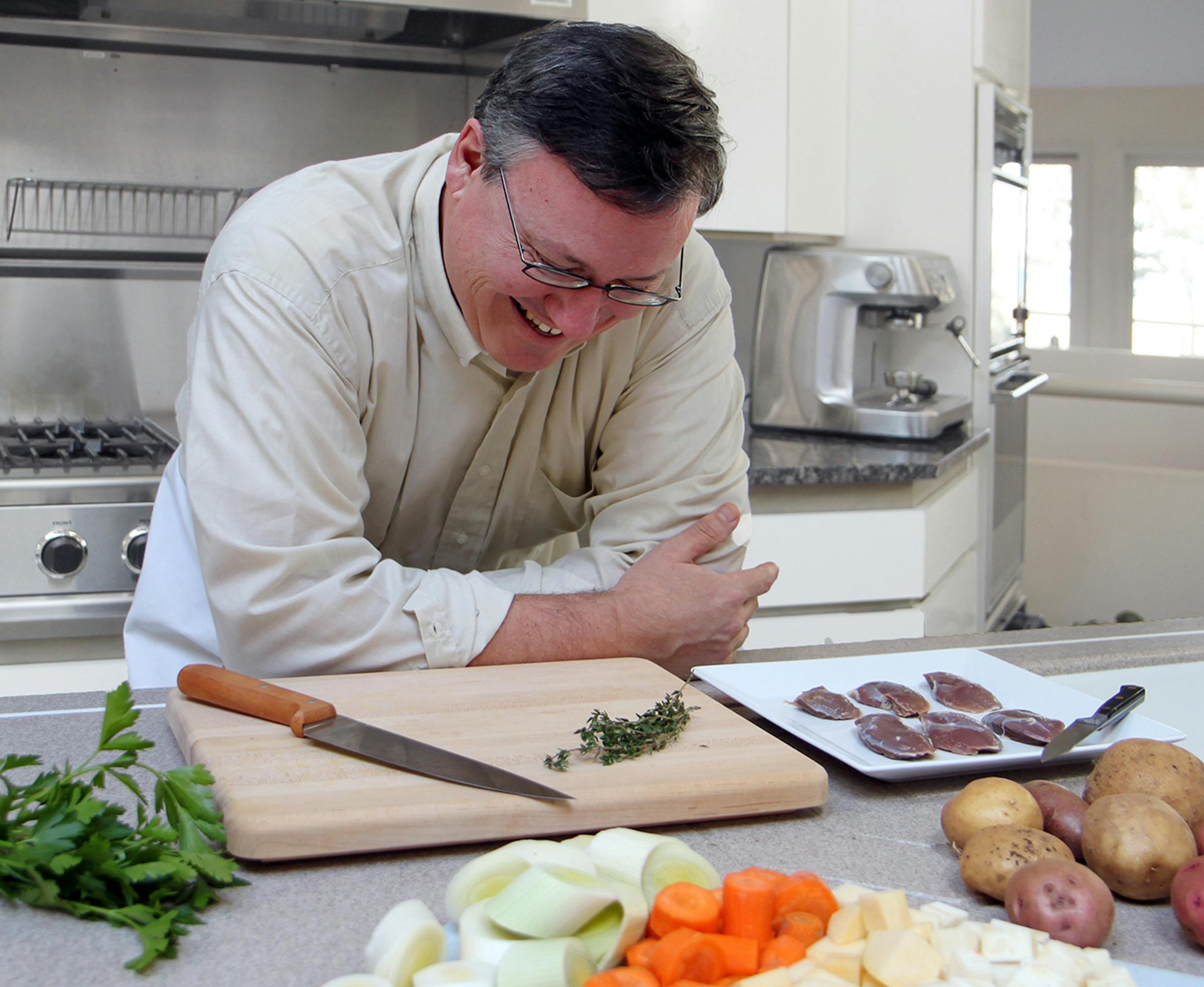 Photo by Mary Jo Hoffman, Special to the Star Tribune Steve Hoffman cooking duck breast, for hunting story by Steve Hoffman.