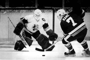 Bowling Green's Dan Kane shot on UMD goalie Rick Kosti during the 1984 NCAA title game.