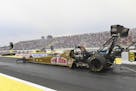 In this photo provided by NHRA, Leah Pritchett starts a run in Top Fuel at the Lucas Oil NHRA Nationals at Brainerd International Raceway on Sunday, A