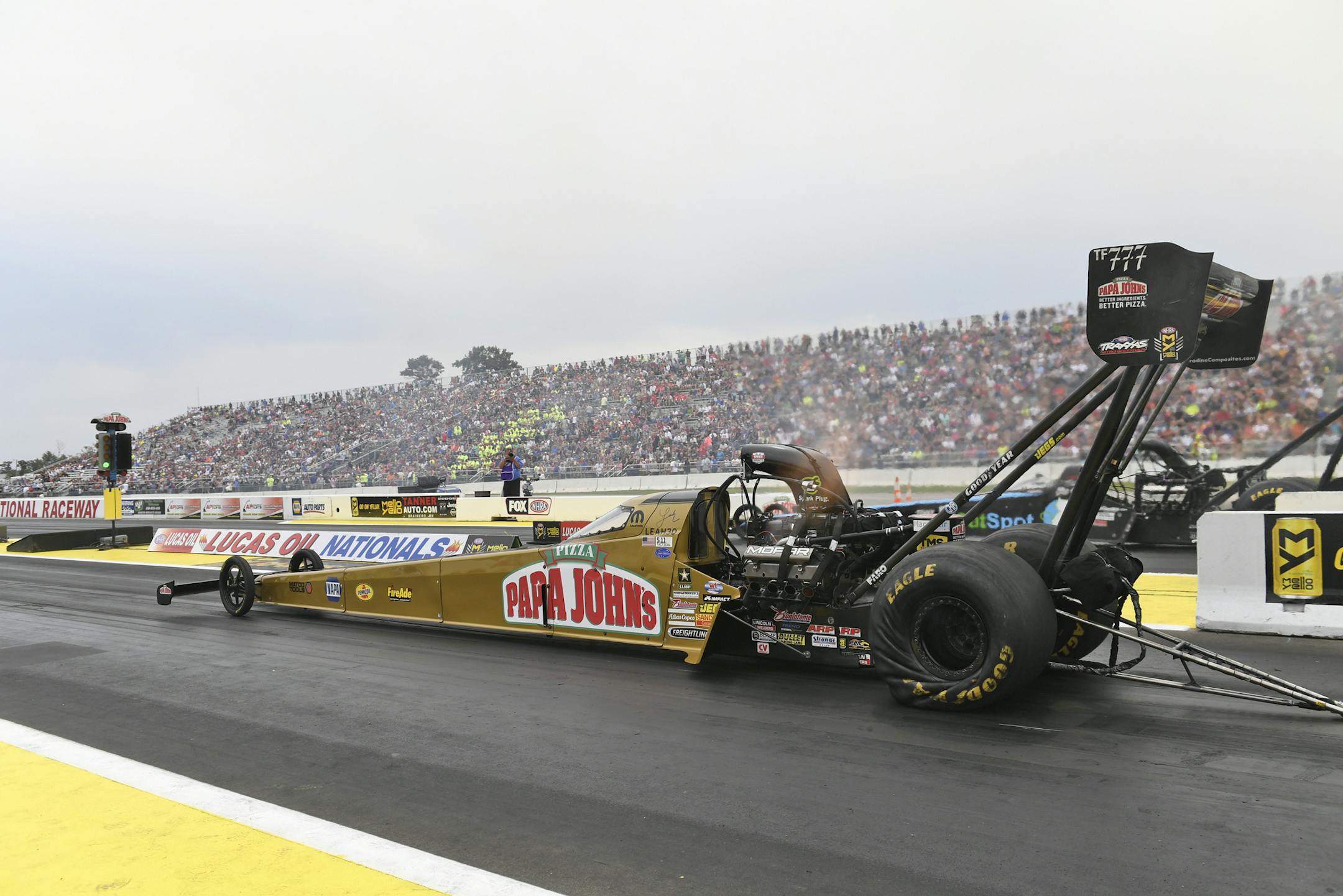 In this photo provided by NHRA, Leah Pritchett starts a run in Top Fuel at the Lucas Oil NHRA Nationals at Brainerd International Raceway on Sunday, Aug. 20, 2017, in Brainerd, Minn. Pritchett defeated Antron Brown in the final. (Jerry Foss/NHRA via AP)