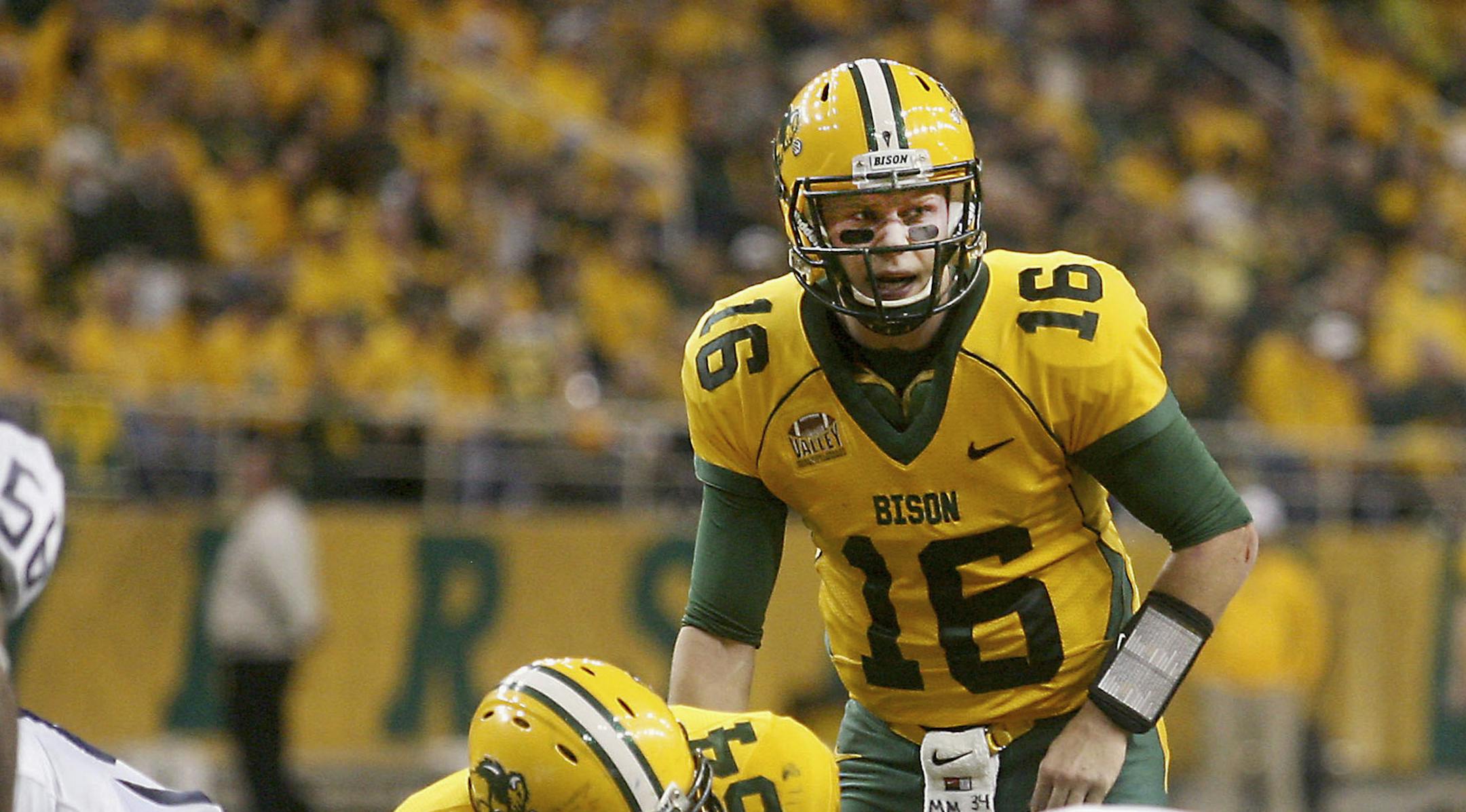 CORRECTS CAPTION - FILE - FILE - In this Dec. 20, 2013 file photo, North Dakota State quarterback Brock Jensen (16) prepares to take a snap during his team's 52-14 win in a NCAA Football Championship Subdivision semifinal game over New Hampshire at the Fargodome in Fargo, N.D. Jensen has neither the flair nor the eye-popping statistics of some of his fellow signal-callers who have been nominated as the best players in the FCS. All Jensen does is win, more than any other QB in the history of the