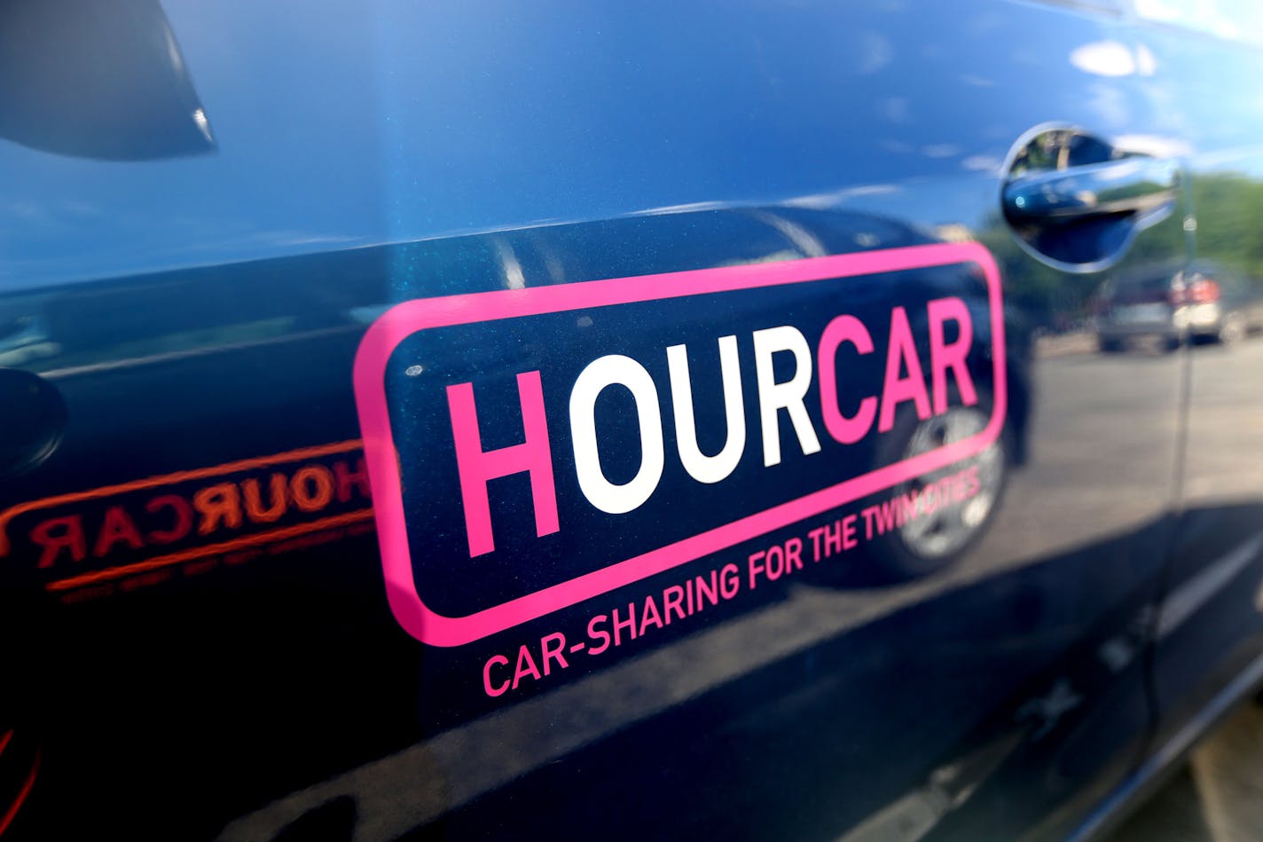 Hourcars parked near Macalester College. ] (KYNDELL HARKNESS/STAR TRIBUNE) kyndell.harkness@startribune.com Car2Go begins service in St. Paul starting July 19, it was announced Wednesday. Looking to catch folks using HourCars, another car sharing service Shot in St. Paul Min. Wednesday, July 2, 2014.