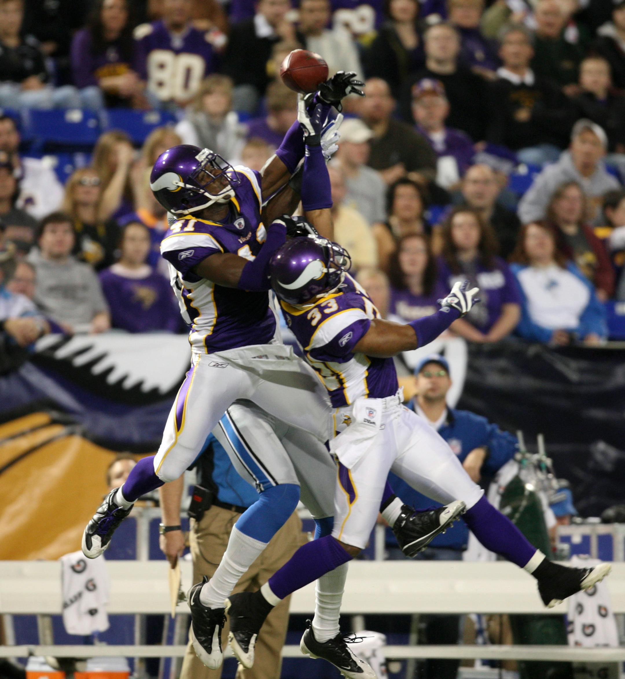 Vikings cornerback Karl Paymah (41) and cornerback Jamarca Sanford (33) double teamed the Lions' Calvin Johnson to break up a fourth quarter pass Sunday afternoon.