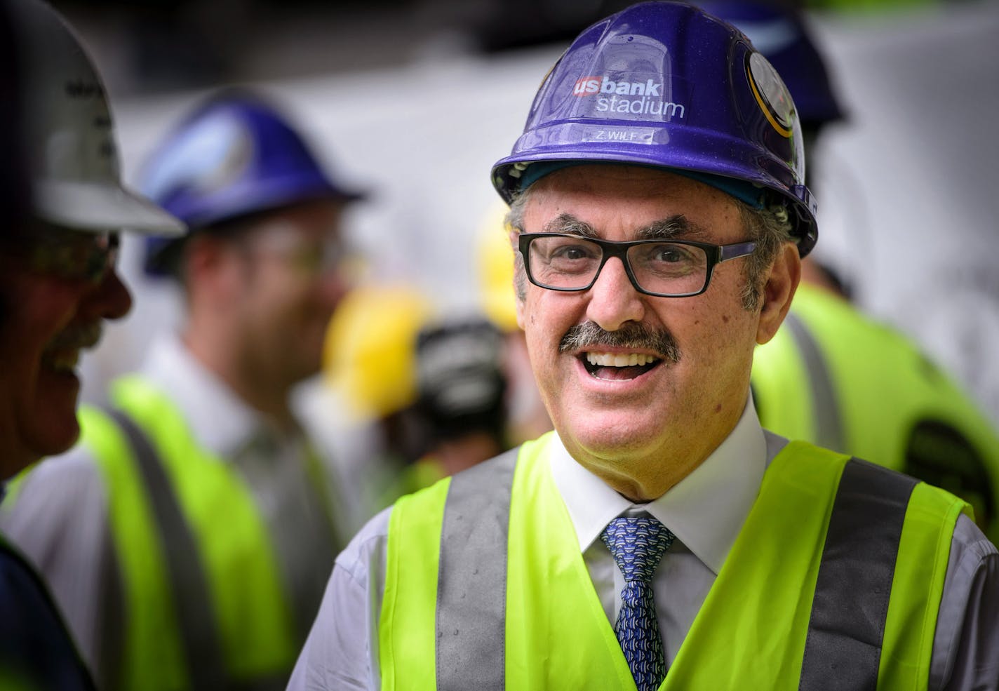 Vikings owner Zygi Wilf. ] GLEN STUBBE * gstubbe@startribune.com Thursday September 16, 2015 A "topping out" ceremony for the new Minnesota Vikings stadium, marking the highest or last piece of steel placed on a building. Mark Wilf and Lt. Gov. Tina Smith were there. Heavy rain and lightening in the area made it unsafe to hoist the steel beam to the roof. Workers were treated to a free pork chop lunch.