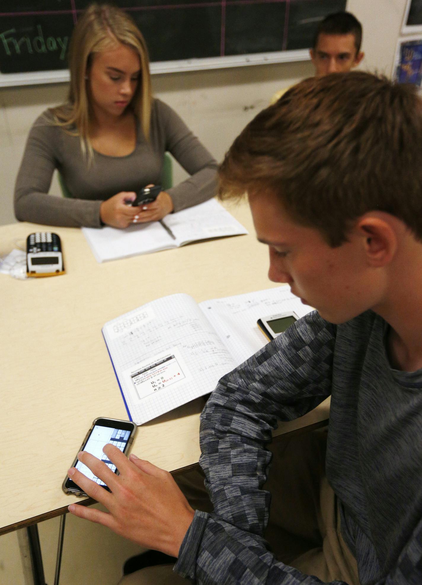 Ben Murray and Kaida Bisbis used their cellphones in Sara Van Der Werf&#x2019;s advanced algebra class at South High.