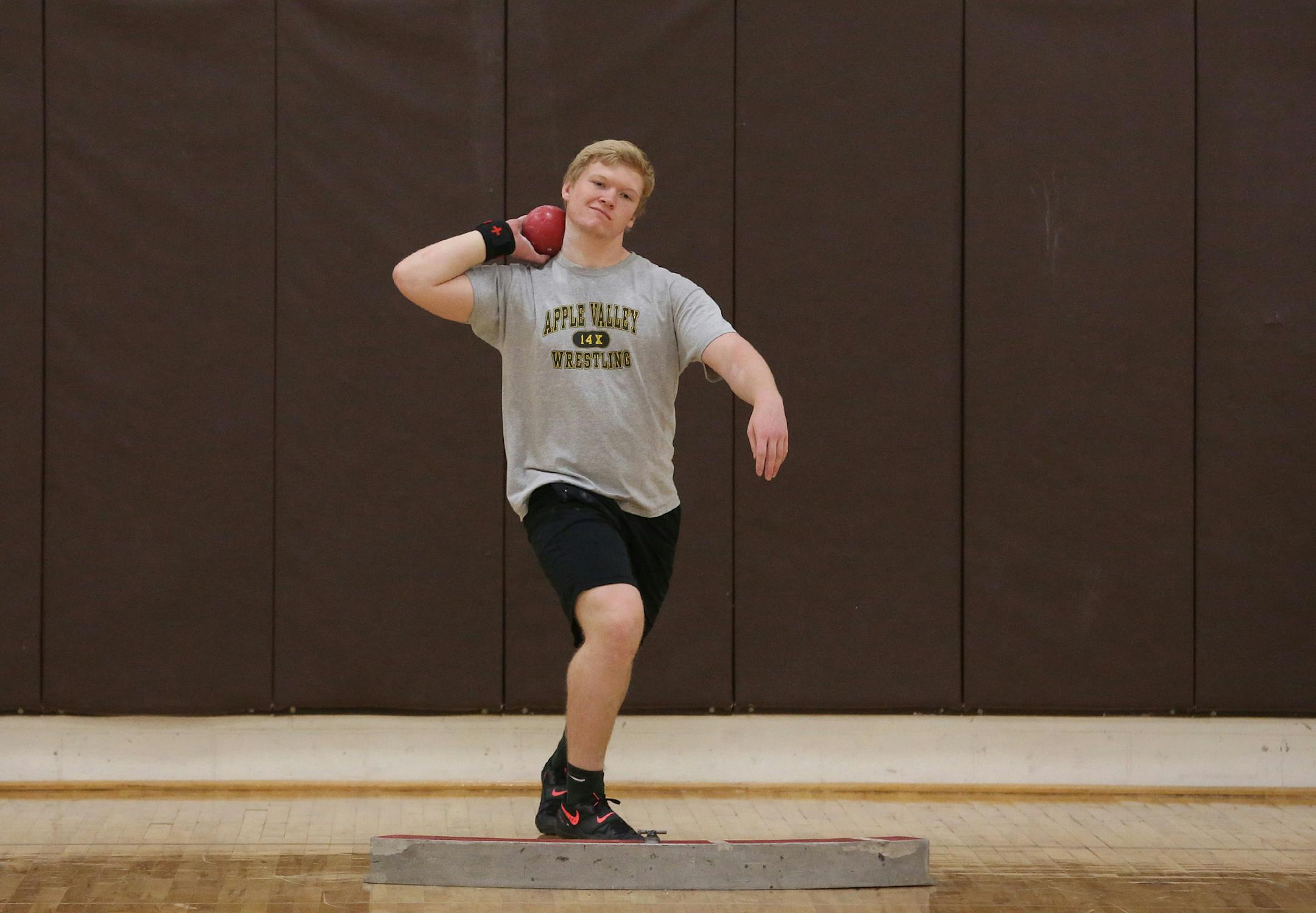 Kieren McKeag worked on his technique with the shot during practice. ] (KYNDELL HARKNESS/STAR TRIBUNE) kyndell.harkness@startribune.com Track and field practice in Apple Valley Min., Tuesday, March 24, 2015