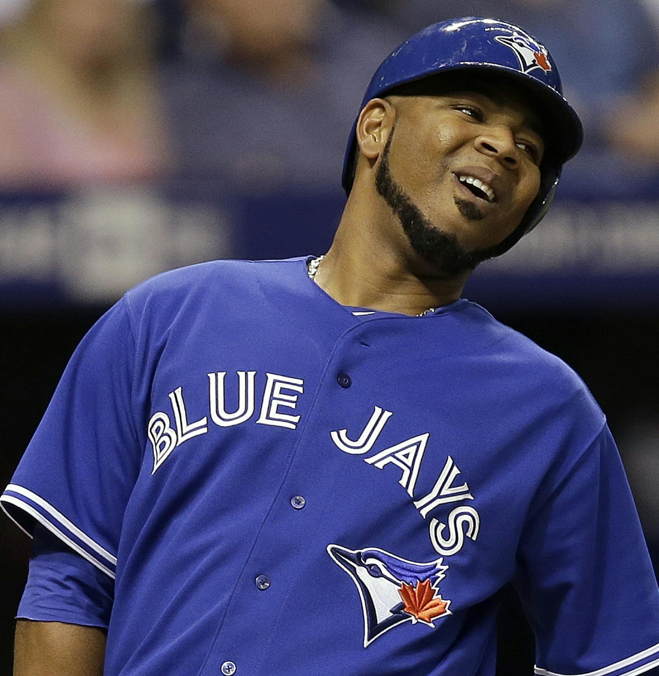 Toronto Blue Jays' Edwin Encarnacion reacts after being called out on strikes by home plate umpire Jim Wolf on a fifth-inning pitch by Tampa Bay Rays starting pitcher Matt Moore during a baseball game Wednesday, April 2, 2014, in St. Petersburg, Fla. (AP Photo/Chris O'Meara) ORG XMIT: SPD111