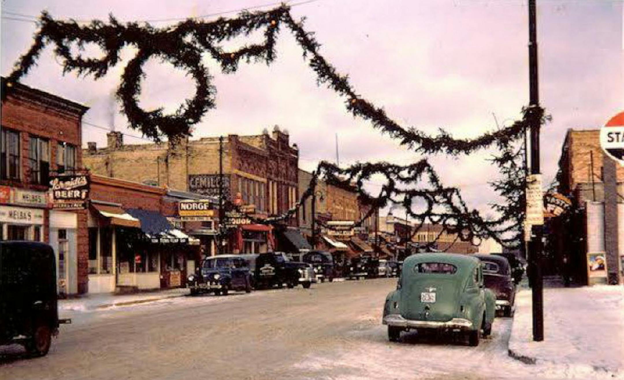Archived photo of Water Street, the main street in Excelsior, decorated for Christmas in the 1940s or 1950s. Courtesy of Excelsior-Lake Minnetonka Historical Society. ORG XMIT: 7ULsX1Rru9C28AyC79p8 Submitted by Excelsior-Lake Minnetonka Historical Society