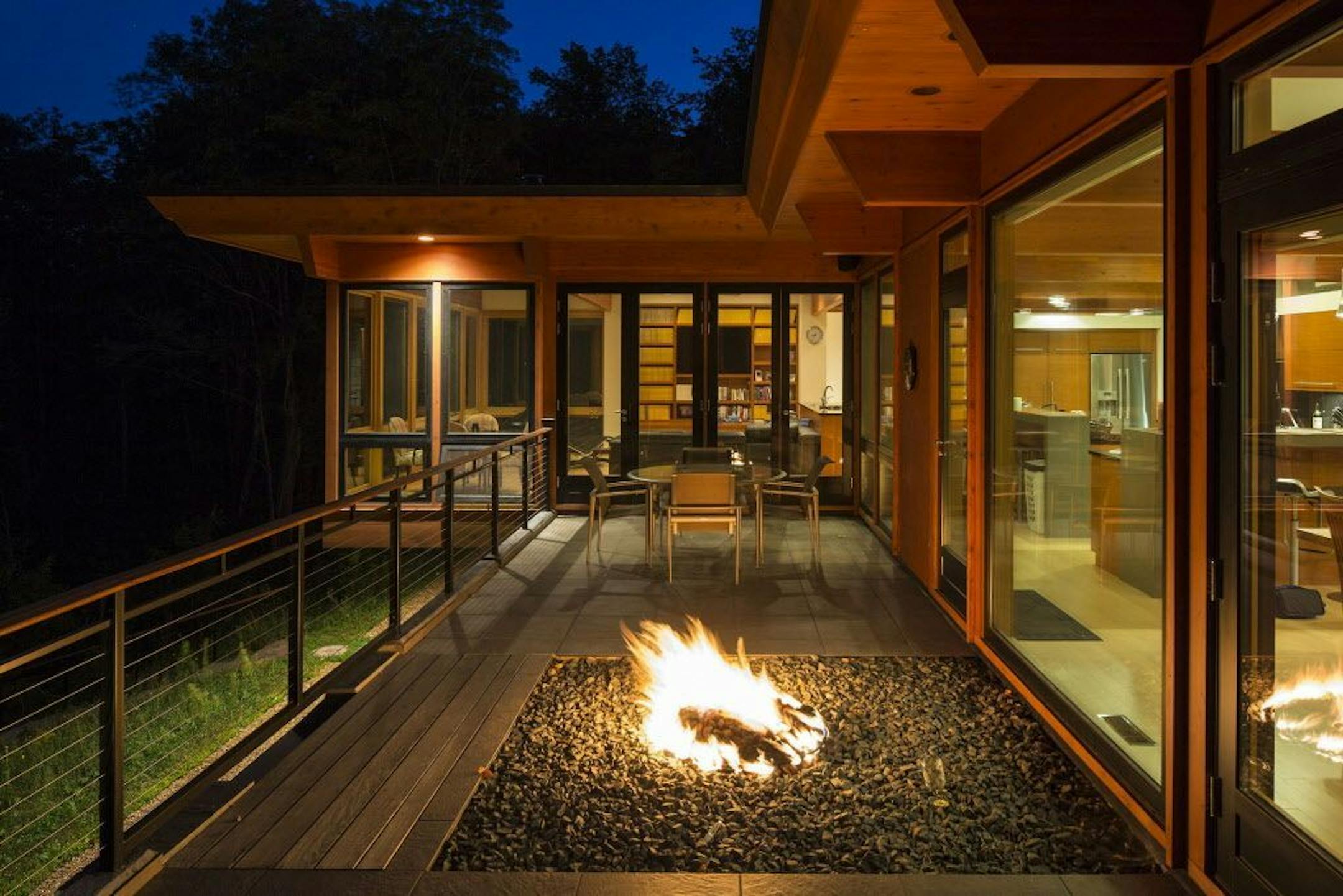 Fiery accent on the deck of a lakeside vacation home, by Katherine Hillbrand, SALA Architects.