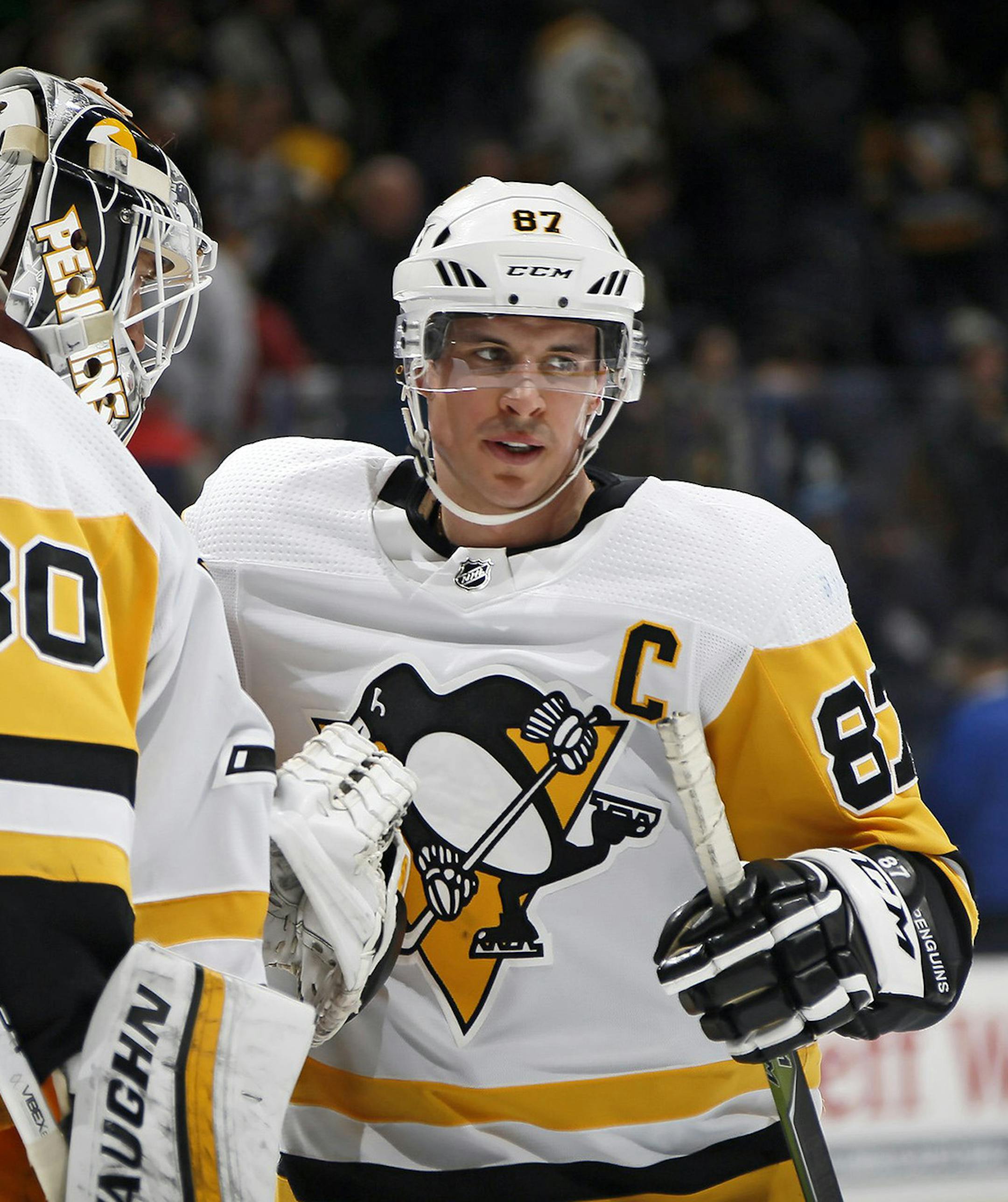 In a February 2019 image, Pittsburgh Penguins center Sidney Crosby (87) celebrates with goaltender Matt Murray (30) following a win against the Columbus Blue Jackets at Nationwide Arena in Columbus, Ohio. The Pens celebrated again on Saturday, Oct. 5, 2019, after a 7-2 romp against the Blue Jackets. (Adam Cairns/Columbus Dispatch/TNS) ORG XMIT: 1452905