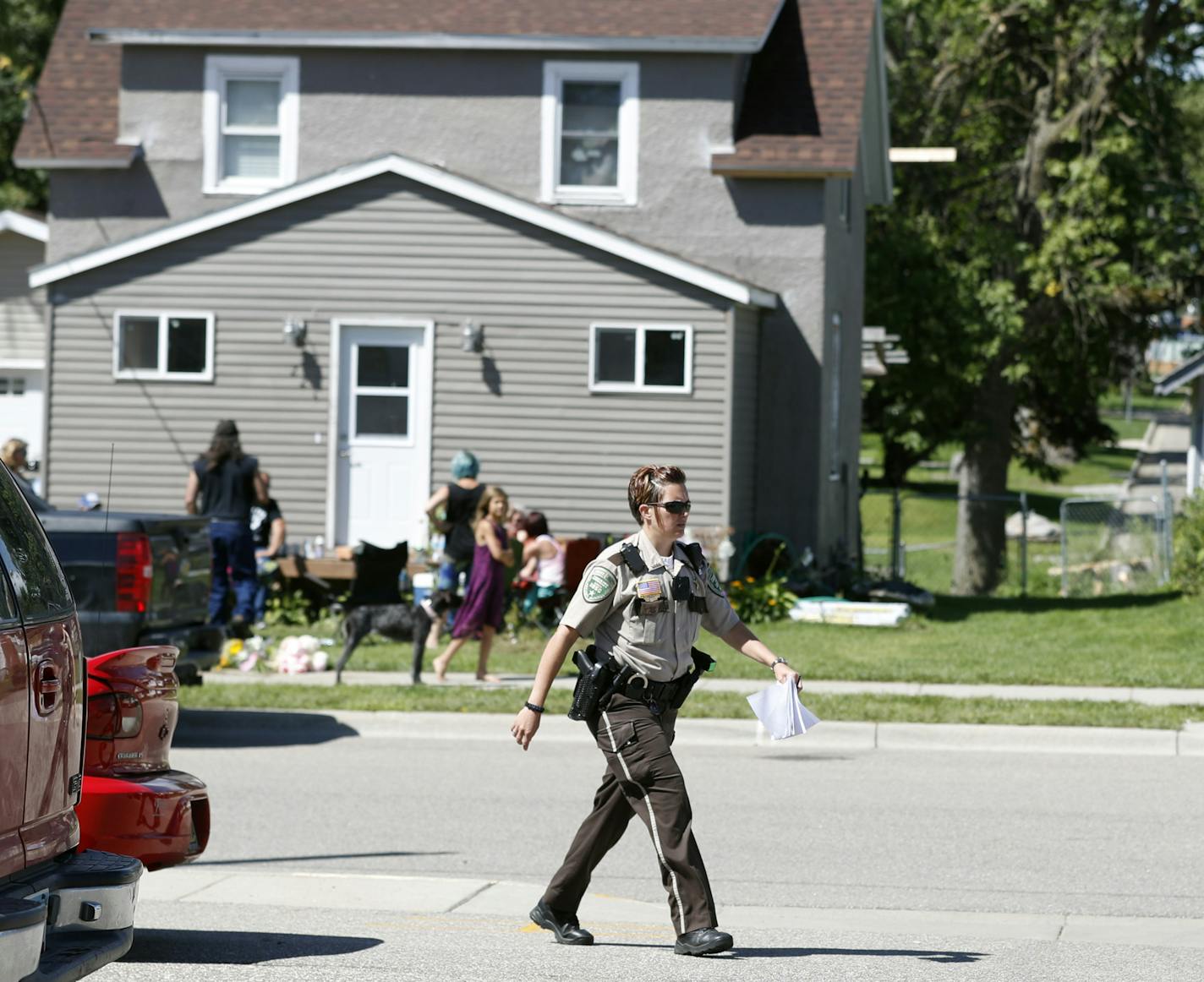 A Meeker county Sheriff&#xed;s deputy walked pass the home were 5-year-old Alayna Ertl lived Sunday August 21, 2016 in Watkins, MN.] Deputies from Meeker county knocked on doors on Meeker Street Sunday morning as the investigation into the death of Alayna continues. Jerry Holt / jerry.Holt@Startribune.com