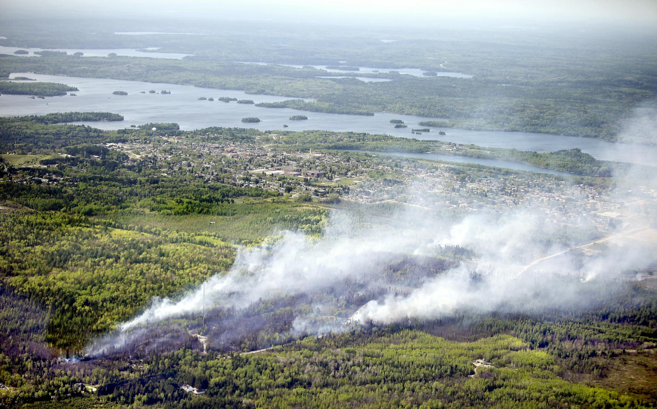 An aerial view of the wildfire that started south of Ely, Minn. Thursday May 17, 2012. A forest fire that broke out Thursday afternoon threatened the northeastern Minnesota town of Ely, and officials ordered the evacuation of the southeast corner of the community.