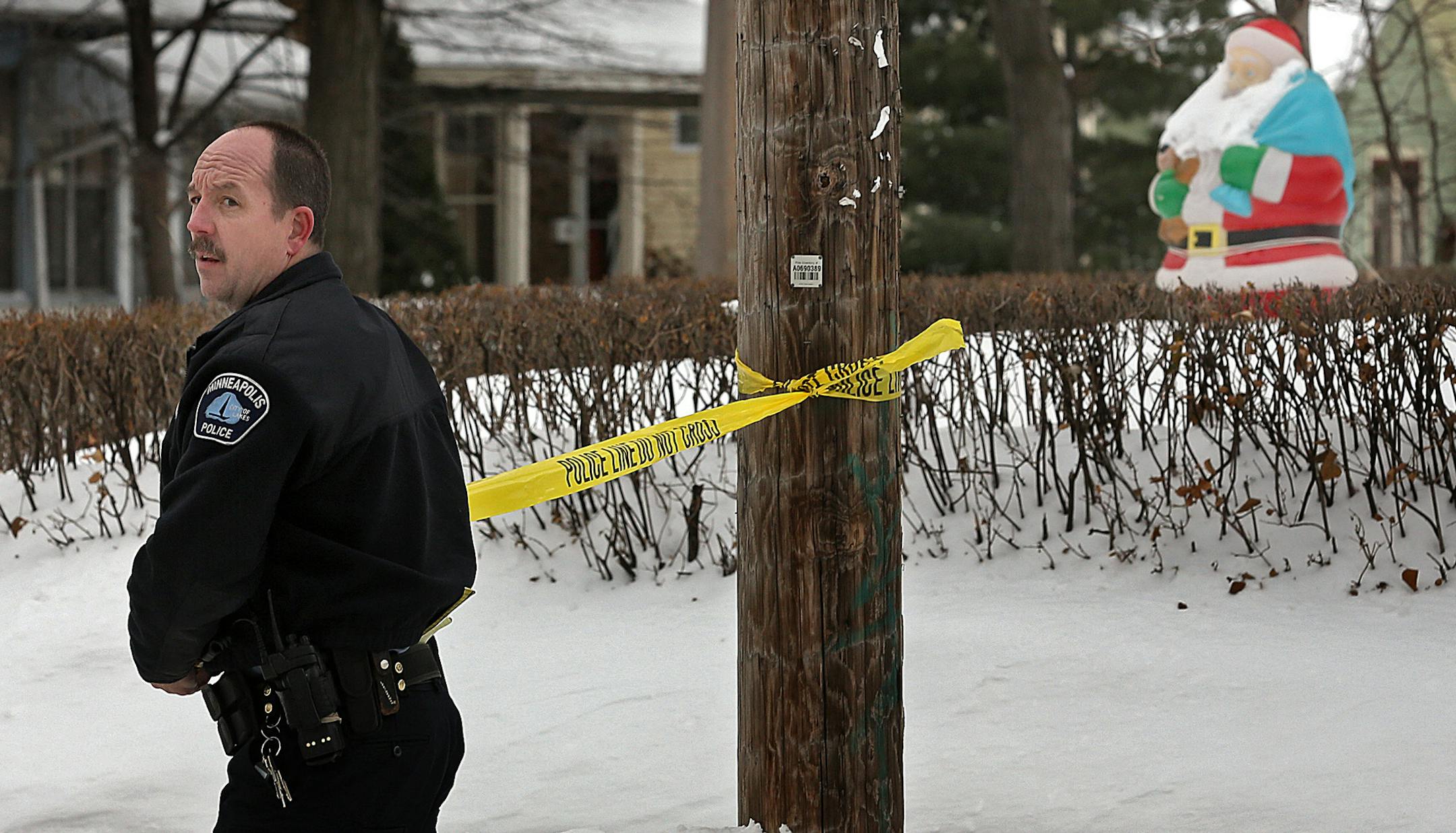 A Minneapolis police officer secured an area along of NE 16th Ave. near NE Marshall St., where federal agents were involved in the gunfire while taking a wanted man into custody.