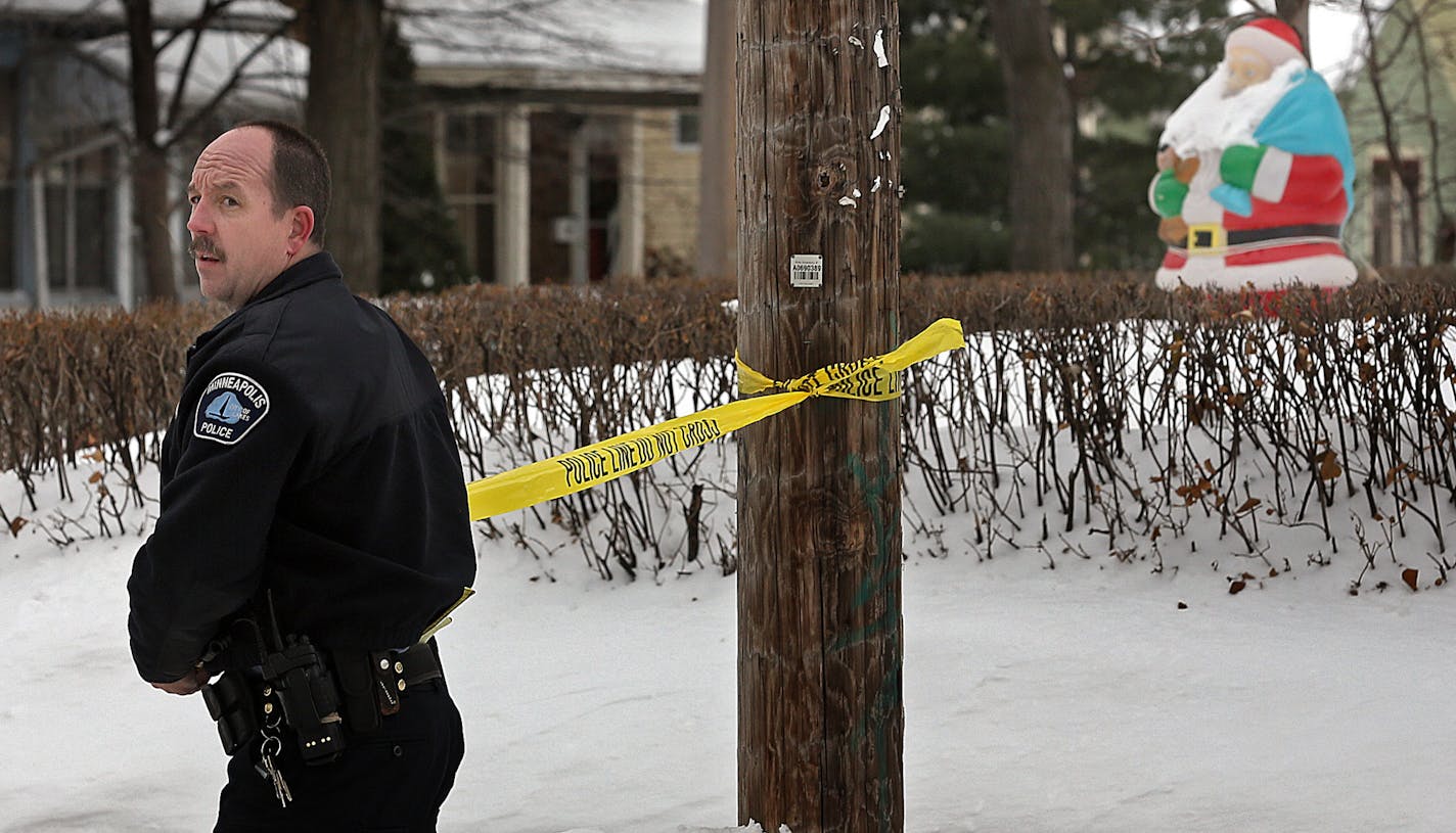 A Minneapolis police officer secured an area along of NE 16th Ave. near NE Marshall St., where federal agents were involved in the gunfire while taking a wanted man into custody.