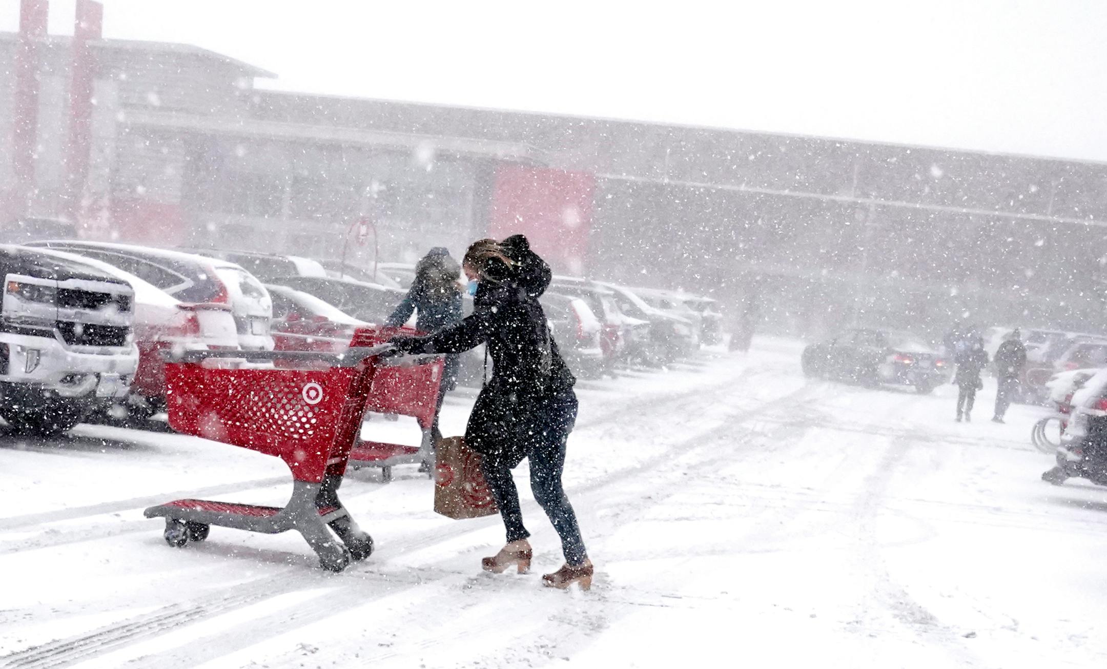 Shoppers endured blizzard conditions while shopping for groceries before the holidays Wednesday the Super Target in Richfield.