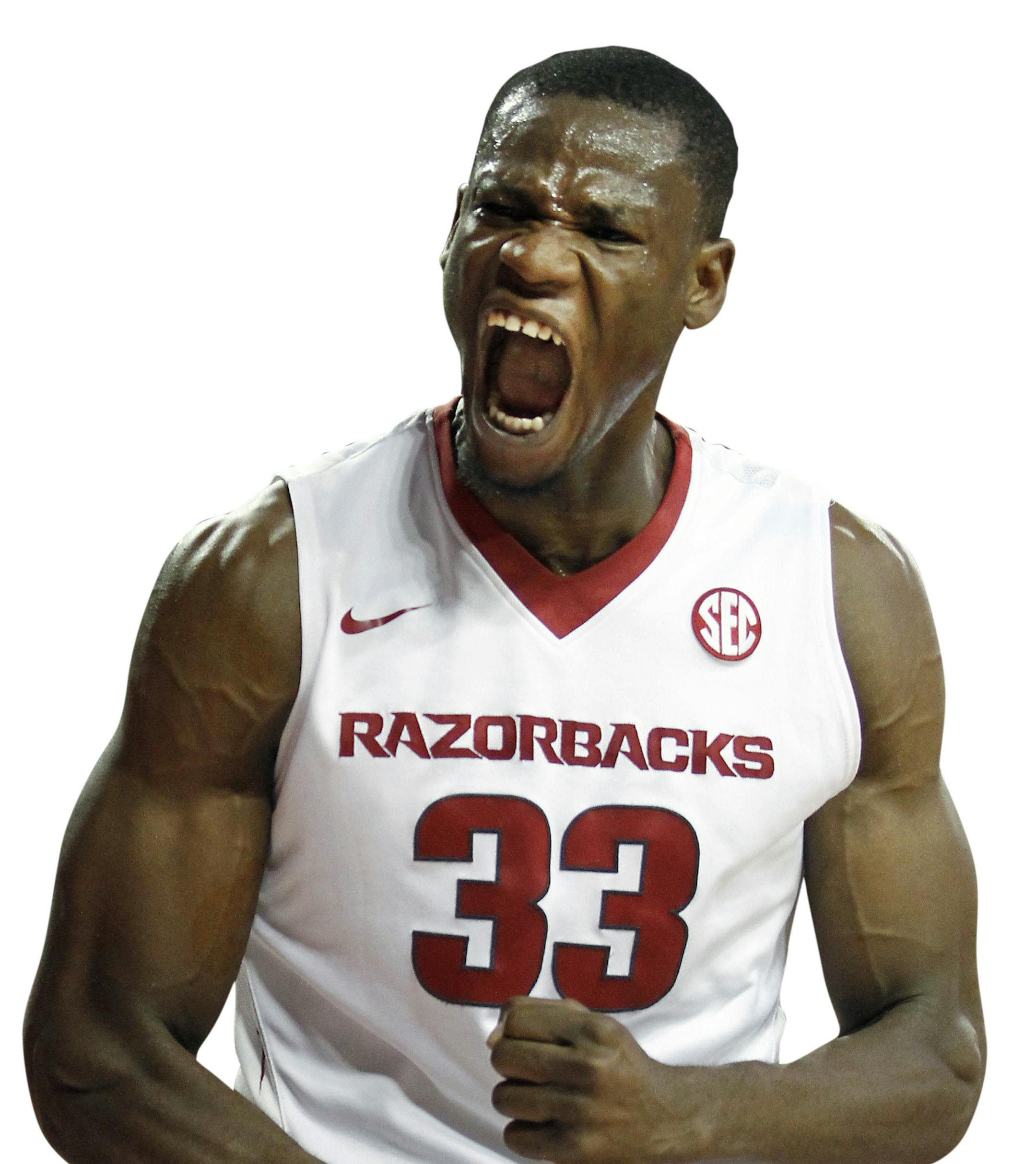 FILE - In this Nov. 13, 2015, file photo, Arkansas' Moses Kingsley (33) shouts after dunking the ball during the second half of an NCAA college basketball game against Southern University, in Fayetteville, Ark. Arkansas stumbled to a .500 finish last season, hardly the follow-up coach Mike Anderson had hoped for following a 27-win effort the season before. The Razorbacks believe they are ready to return to that top form this season, thanks to an influx of top junior-college talent _ and the retu