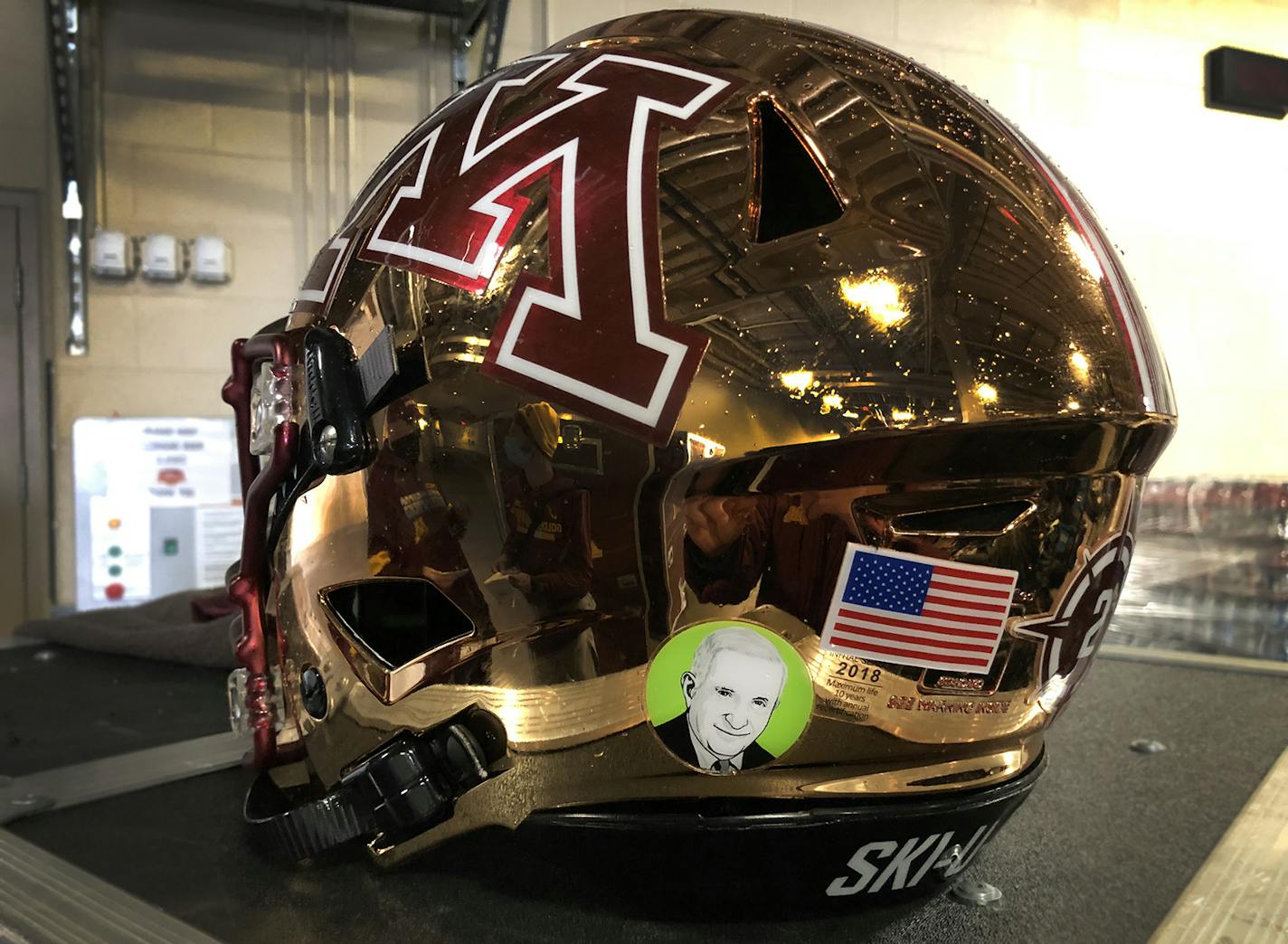 University of Minnesota photo. Sid Hartman sticker on Gophers football helmet. For 10/24/20 game.