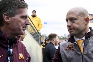 Gophers coach P.J. Fleck shook hands with Athletic Director Mark Coyle following a win over Illinois last season.