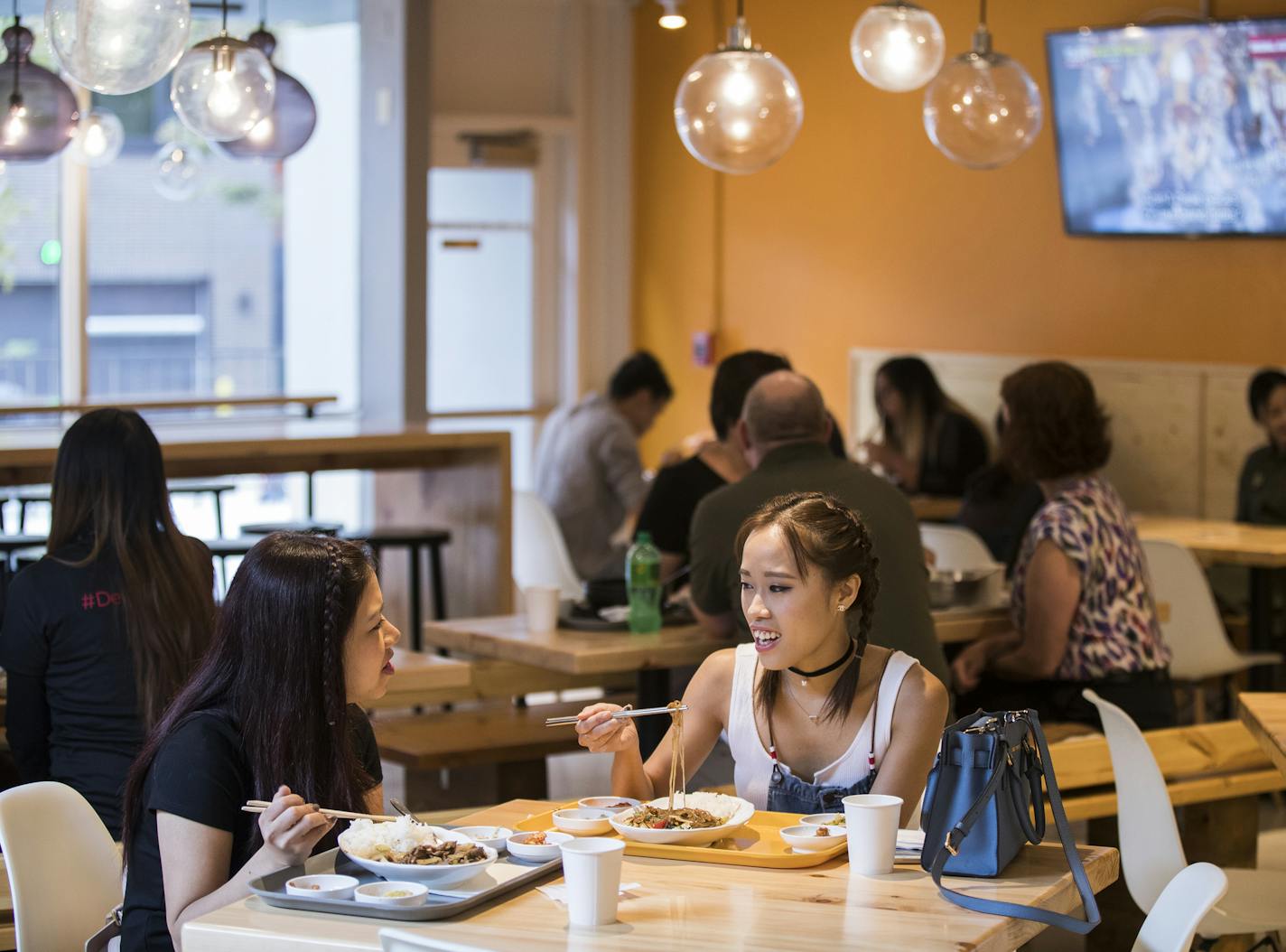 Van Nguyen, left, and Hannah Luong enjoyed lunch at K-Bop Korean Bistro, one of several new restaurants near the University of Minnesota.