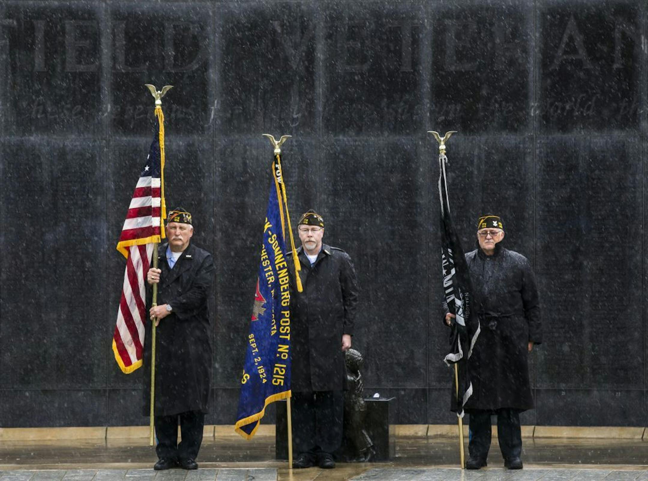 Rochester VFW Post 1215 Honor Guard members presented the colors during a shortened Memorial Day military salute in the rain. Three twisters touched down in nearby Fillmore County on Monday.