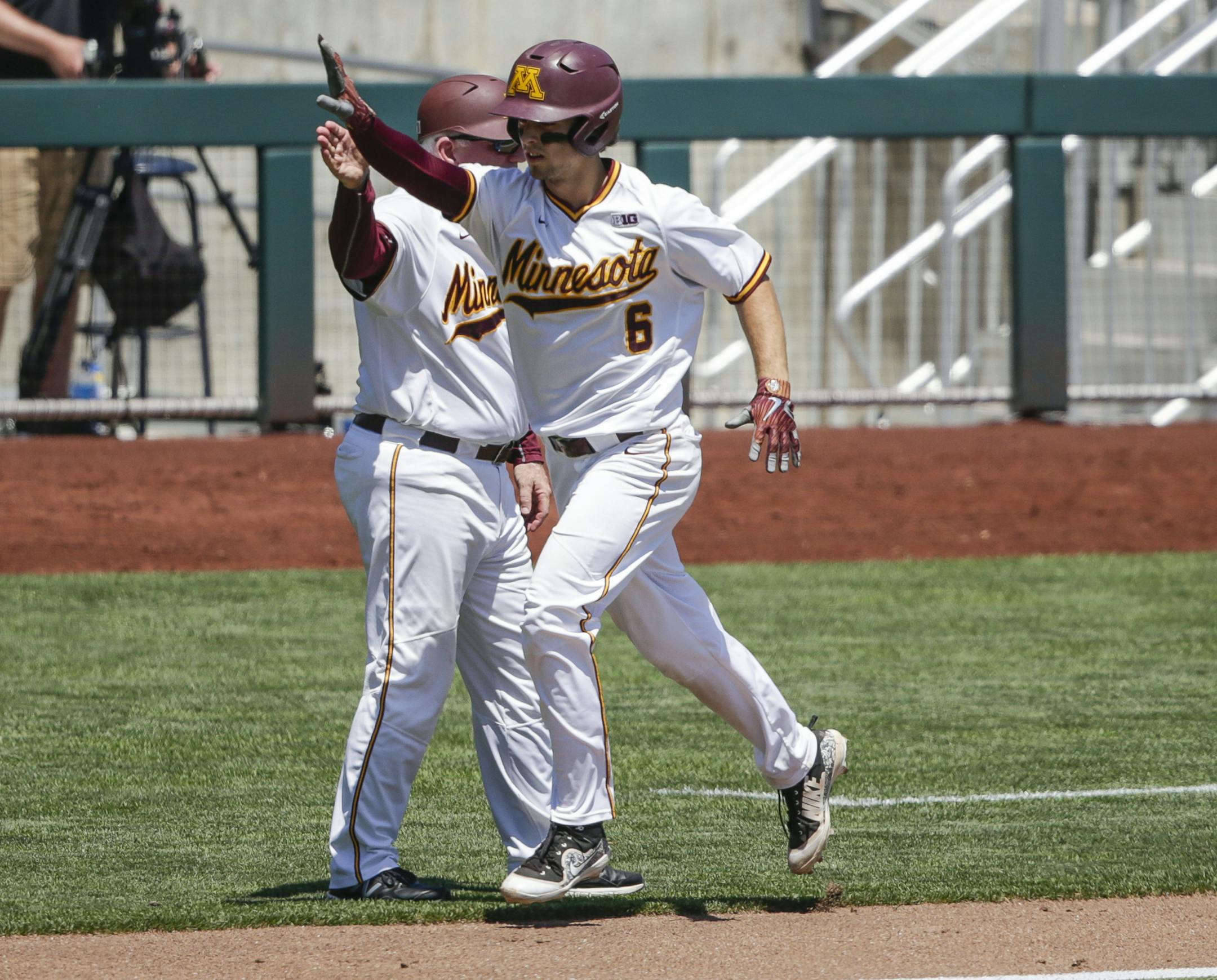 Minnesota's Terrin Vavra (6) rounds the bases after hitting a solo home run against Purdue during the third inning of the NCAA Big Ten baseball championship game in Omaha, Neb., Sunday, May 27, 2018. (AP Photo/Nati Harnik) ORG XMIT: NENH106