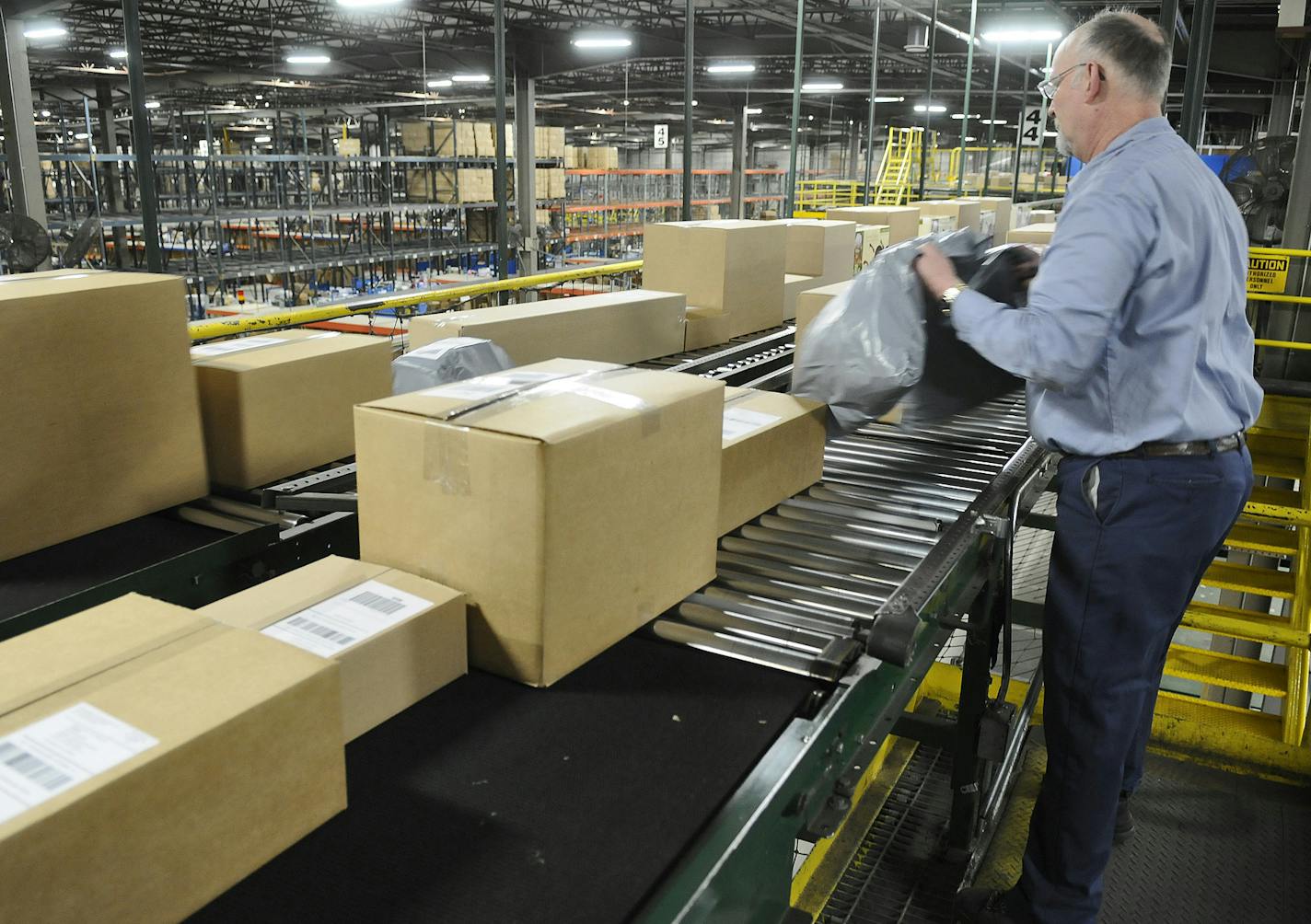 Virgil Nelson, a maintenance staffer at Bluestem Brands Inc., pulled a package.