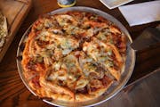 Mama Mia Pizza with porketta, italian sausage, pepperoni, and hot giardiniera from Iron Ranger. Provided photo