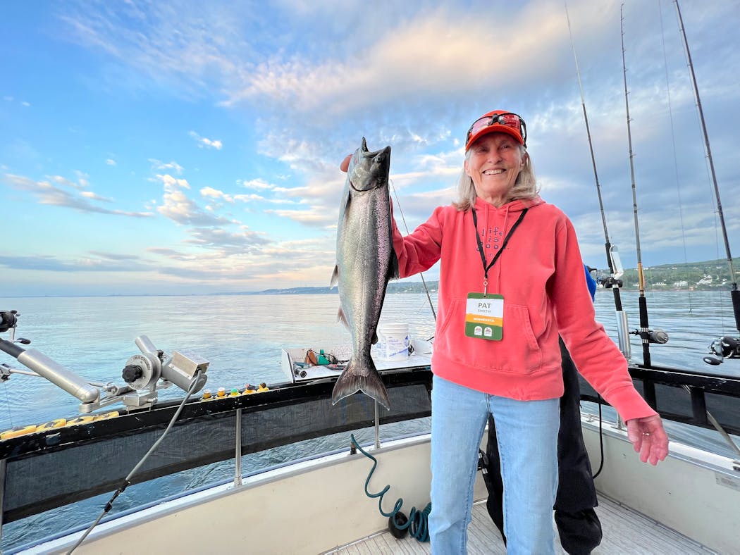 Pat Smith, partner of Bud Grant, with a king salmon caught on Lake Superior.