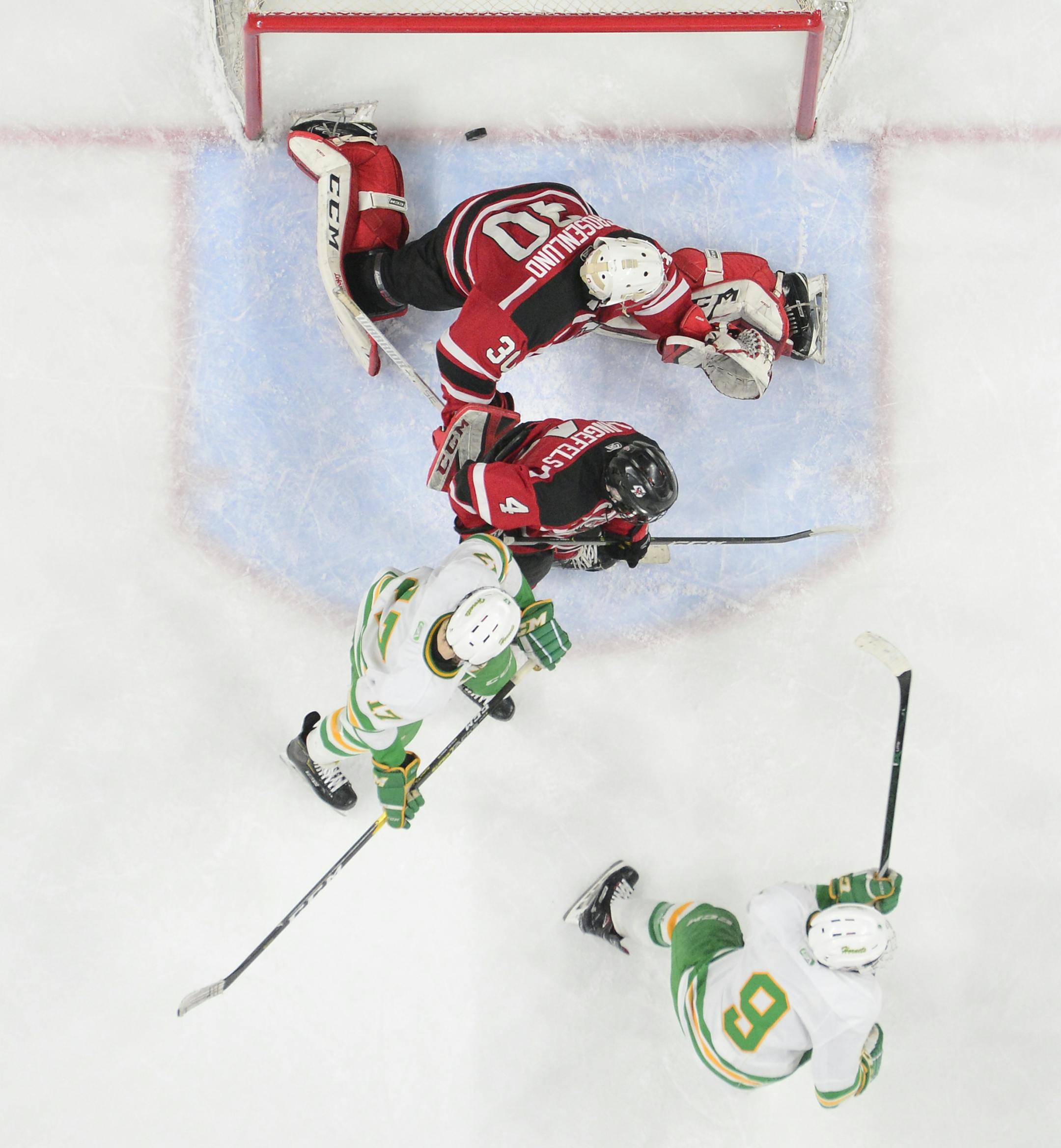 Edina forward Peter Colby (9) scored the game-winner in overtime against Eden Prairie goaltender Axel Rosenlund (30). ] Aaron Lavinsky ¥ aaron.lavinsky@startribune.com Edina played Eden Prairie in the boys' hockey state tournament Class 2A championship game on Saturday, March 9, 2019 at the Xcel Energy Center in St. Paul, Minn.