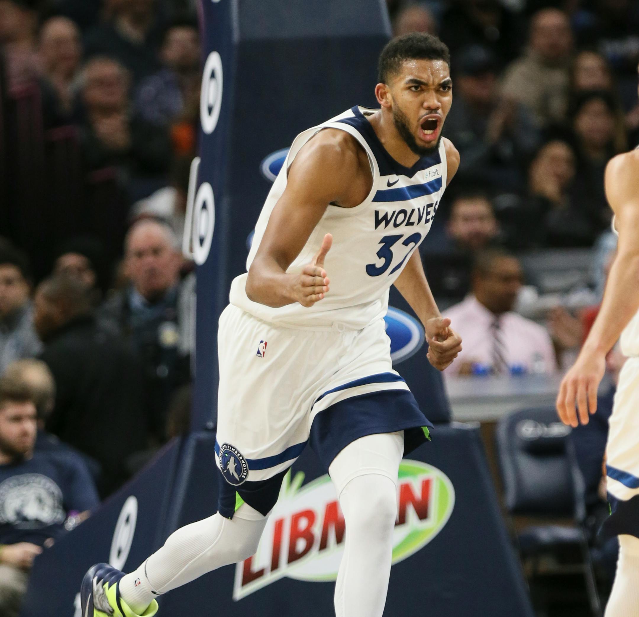 Karl-Anthony Towns celebrates a basket in the second quarter against the San Antonio Spurs at Target Center